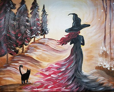Witch with a black cat walking through the woods